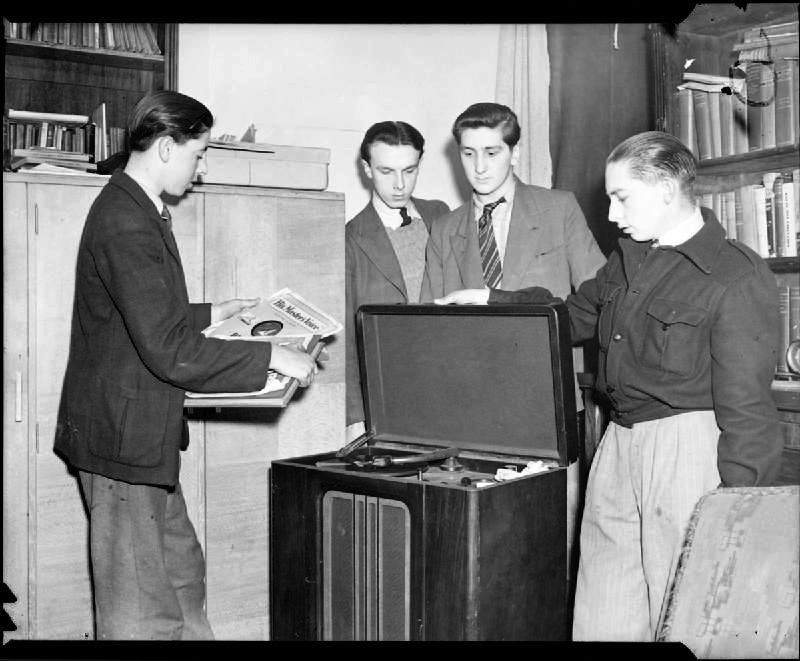 Picture: Boys at the Canterbury Club, part of the Oxford and Bermondsey Boys Club, listening to records on the club's radiogram in 1944. Imperial War Museum - sourced from Wikimedia Commons - public domain.